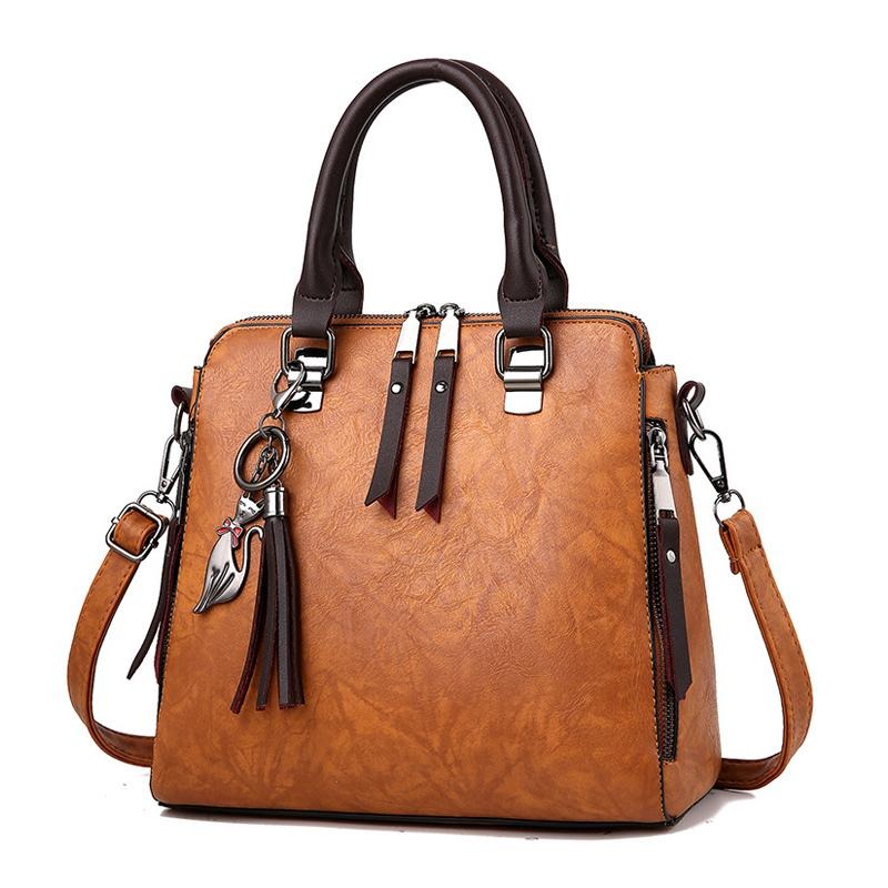 CAT TASSEL DETAILED BROWN LEATHER HANDBAG