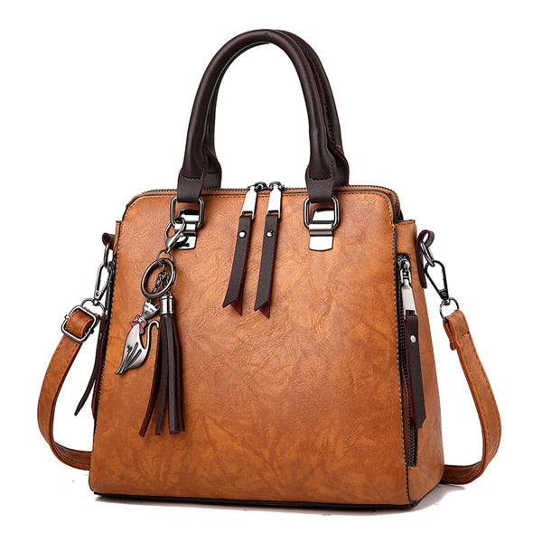 CAT TASSEL DETAILED BROWN LEATHER HANDBAG