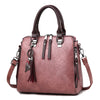 CAT TASSEL DETAILED BROWN LEATHER HANDBAG