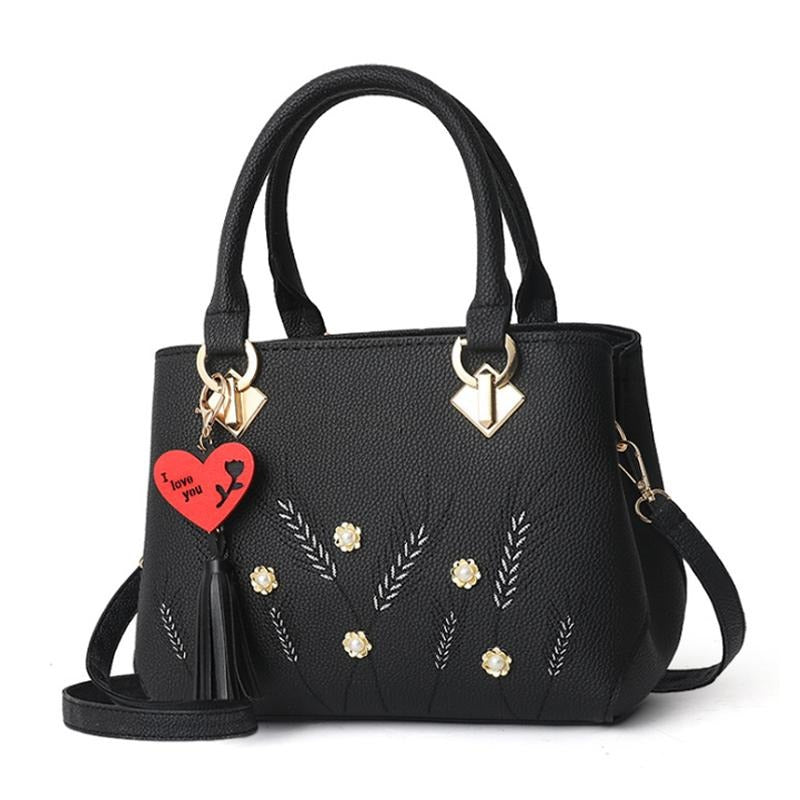 HEART TASSEL DETAILED BLACK HANDBAG