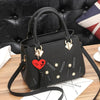 HEART TASSEL DETAILED BLACK HANDBAG