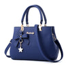 BOW AND FLOWER TASSEL DETAILED BLUE HANDBAG