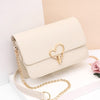 HEART SHAPED BUTTON DETAILED SHOULDER BAG