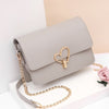 HEART SHAPED BUTTON DETAILED SHOULDER BAG