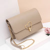 HEART SHAPED BUTTON DETAILED SHOULDER BAG