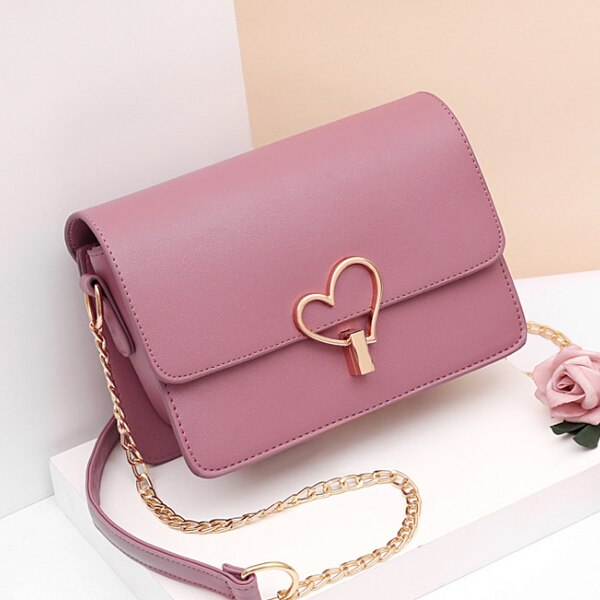 HEART SHAPED BUTTON DETAILED SHOULDER BAG